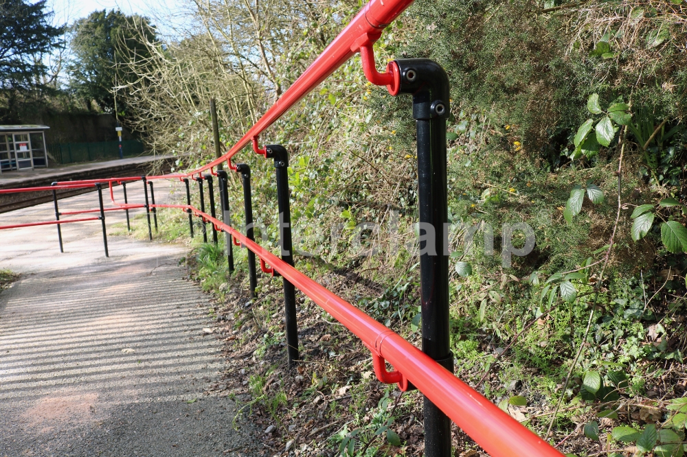 Modular handrail constructed using Interclamp fittings powdercoated in red and black